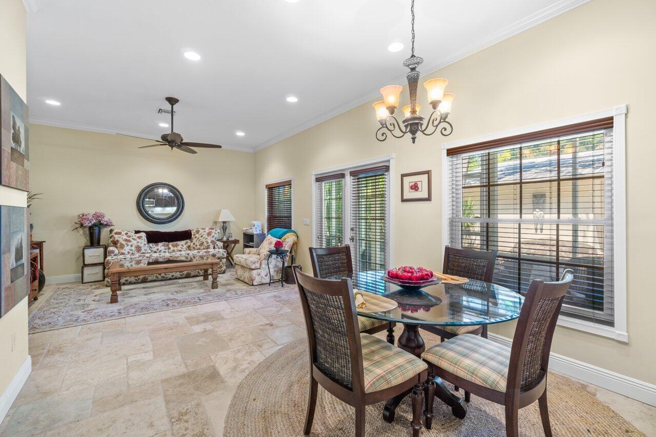 5861 Roebuck Road Jupiter, FL 33458 - Photo 29 of 74 a living room with furniture and window