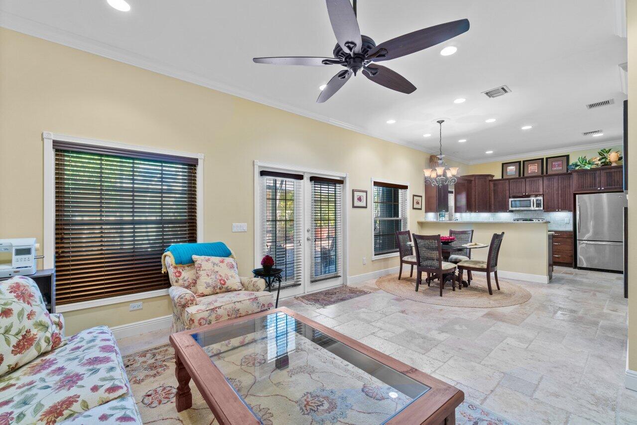 5861 Roebuck Road Jupiter, FL 33458 - Photo 32 of 74 a living room with furniture and a window