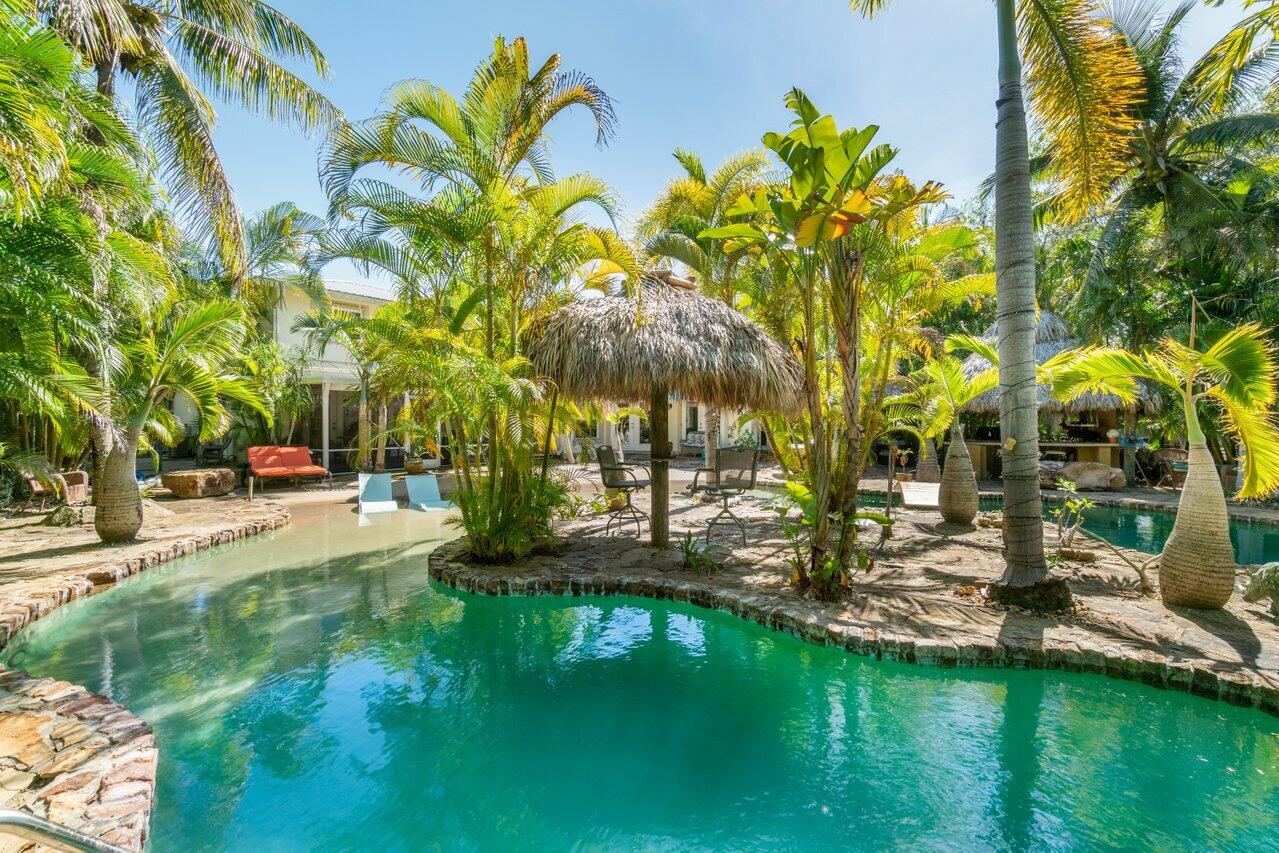 5861 Roebuck Road Jupiter, FL 33458 - Photo 53 of 74 a view of swimming pool with a garden