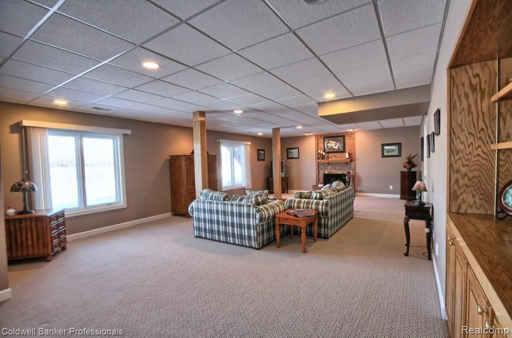 3876 Fawn Drive Rochester, MI 48306 - Photo 32 of 43 Finished Lower level with Gas Fireplace