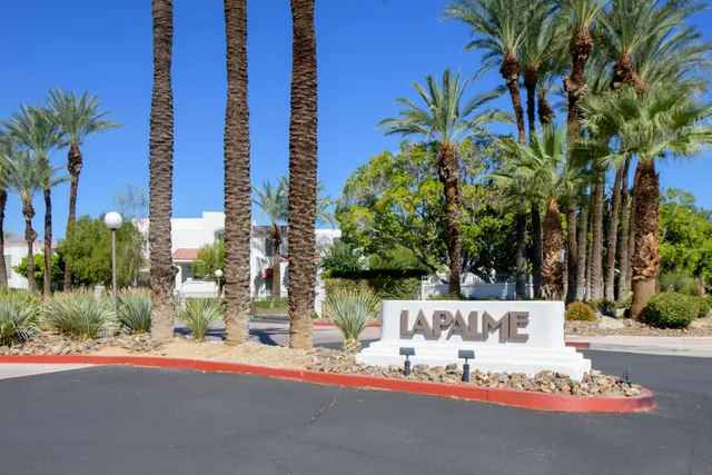 a view of a fountain in front of a house