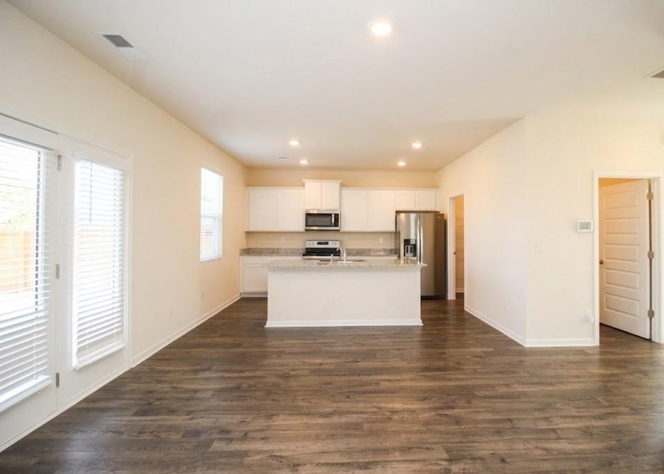 2264 Pelham Pass Dacula, GA 30019 - Photo 12 of 41 a view of kitchen view with wooden floor and window