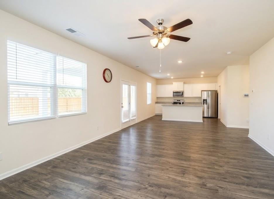 2264 Pelham Pass Dacula, GA 30019 - Photo 13 of 41 a view of an empty room with wooden floor and a window