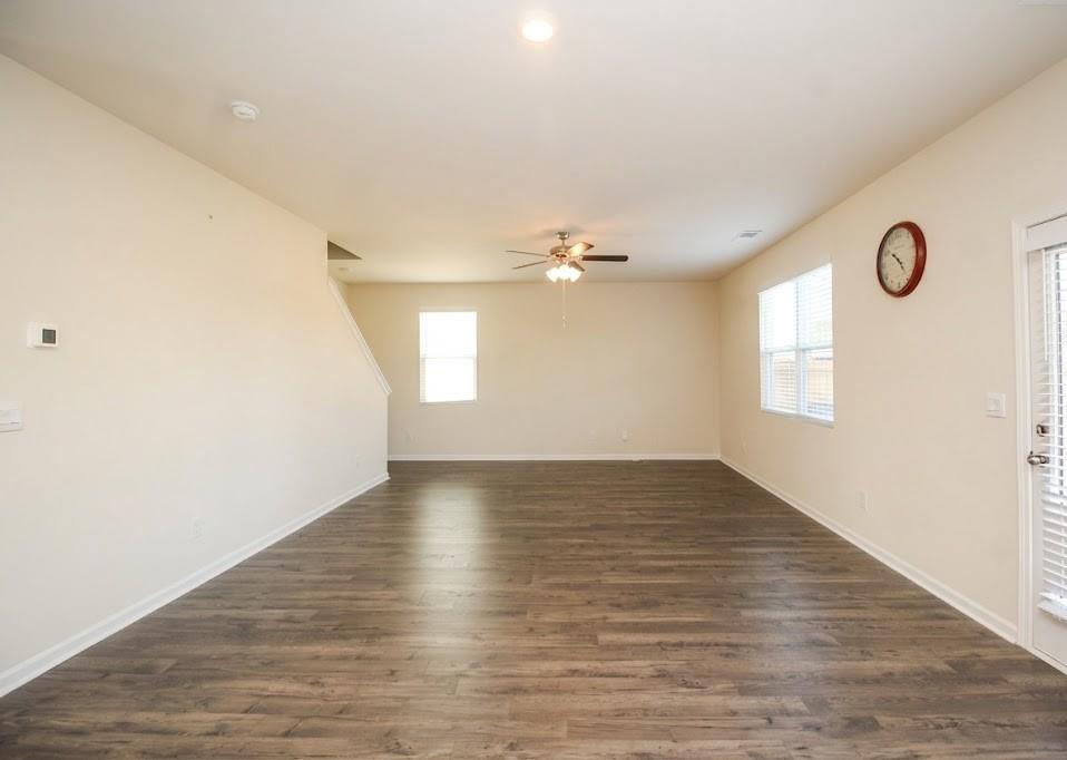 2264 Pelham Pass Dacula, GA 30019 - Photo 23 of 41 a view of an empty room with wooden floor and a window