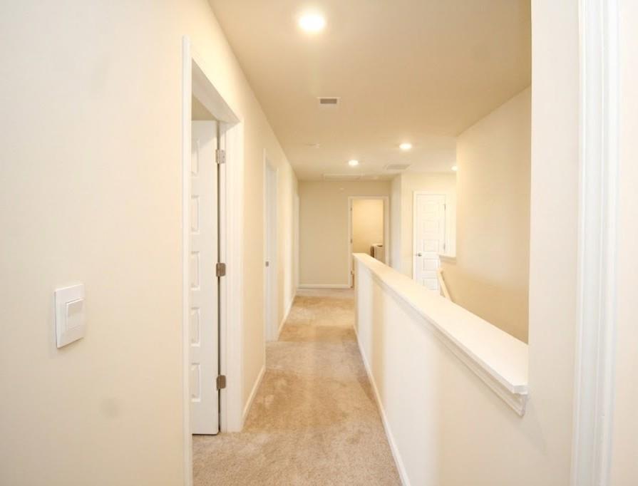 2264 Pelham Pass Dacula, GA 30019 - Photo 25 of 41 a view of a hallway with white walls