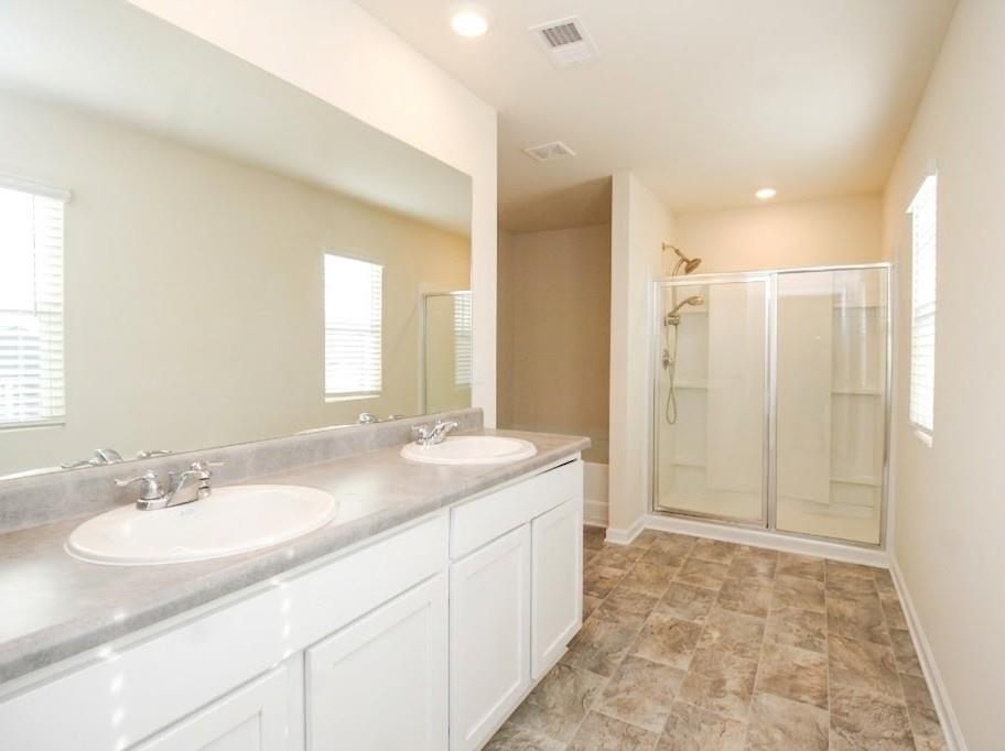 2264 Pelham Pass Dacula, GA 30019 - Photo 28 of 41 a bathroom with a sink double vanity and a mirror