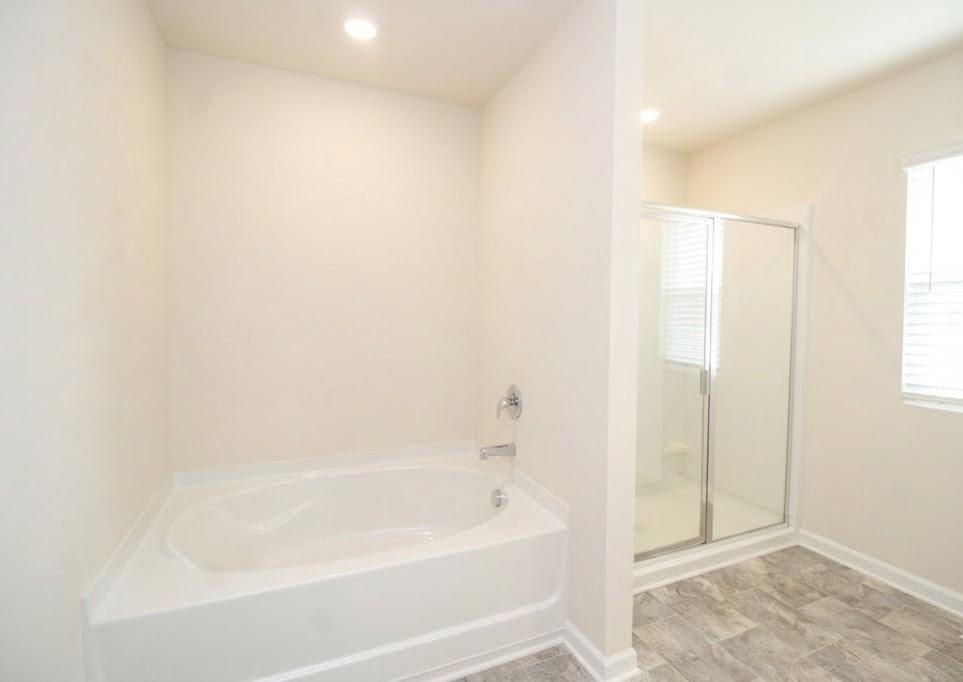 2264 Pelham Pass Dacula, GA 30019 - Photo 29 of 41 a bathroom with a bathtub