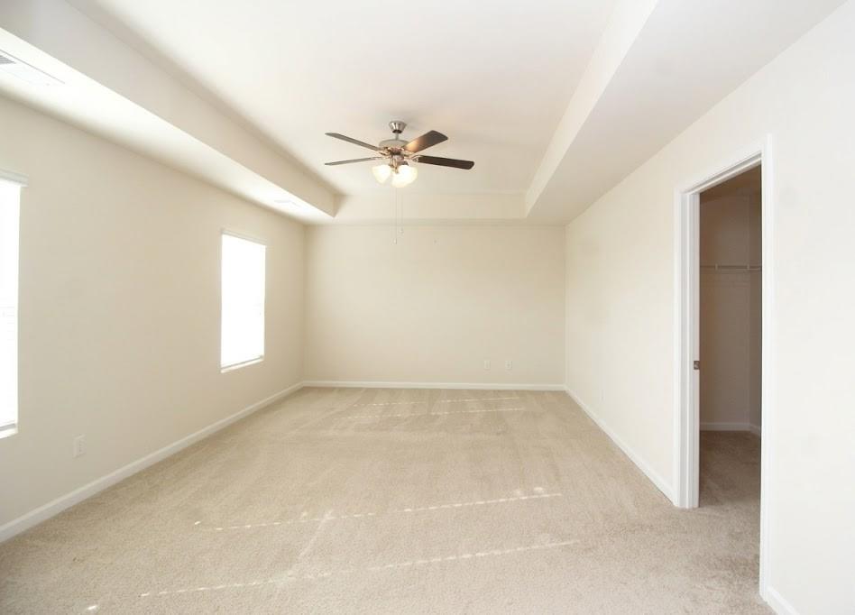 2264 Pelham Pass Dacula, GA 30019 - Photo 30 of 41 an empty room with windows and fan