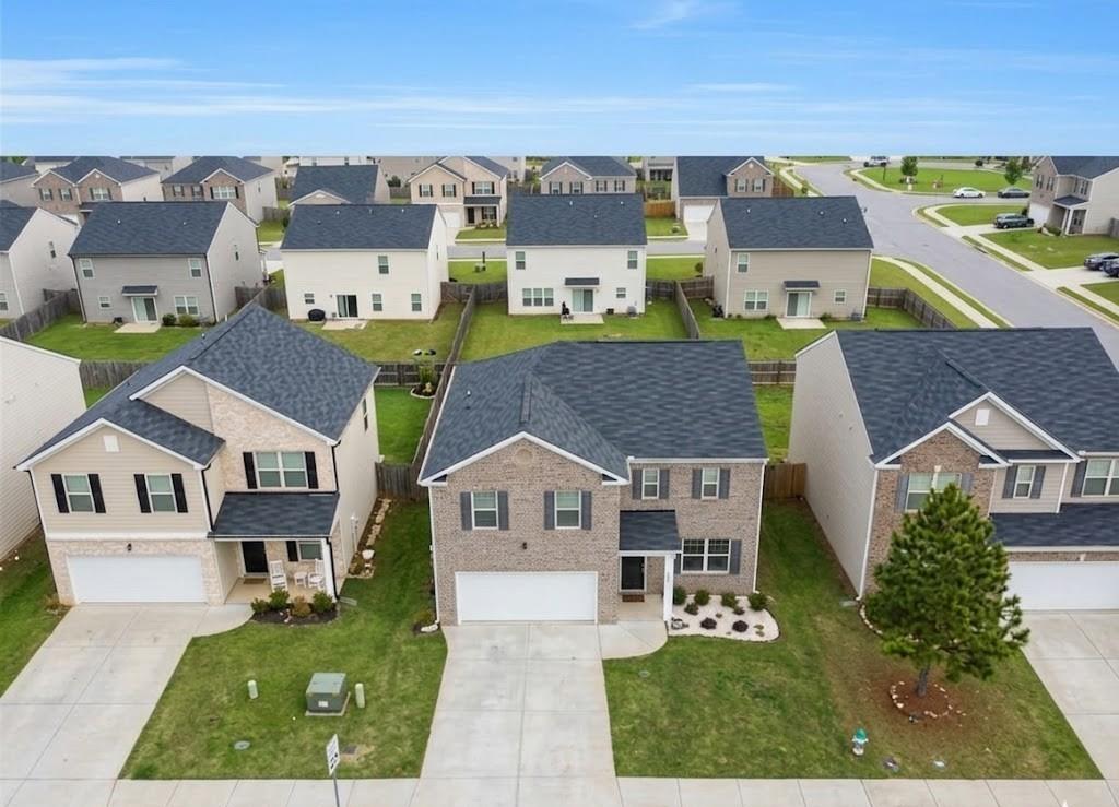 2264 Pelham Pass Dacula, GA 30019 - Photo 3 of 41 an aerial view of residential houses with outdoor space and parking