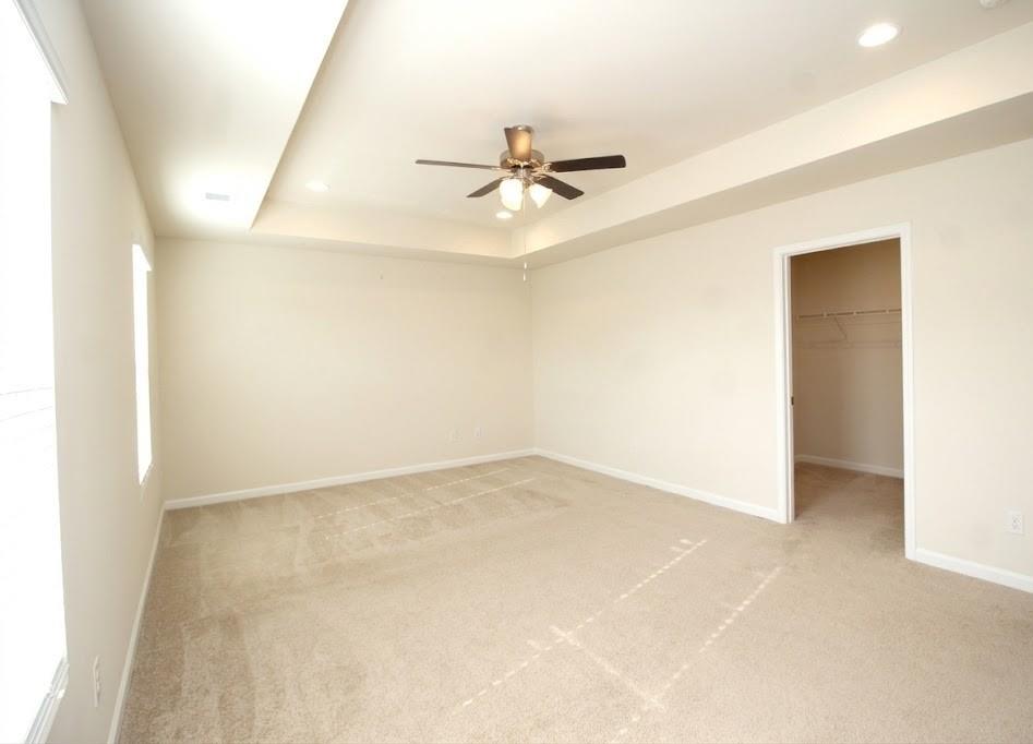 2264 Pelham Pass Dacula, GA 30019 - Photo 31 of 41 an empty room with windows and fan