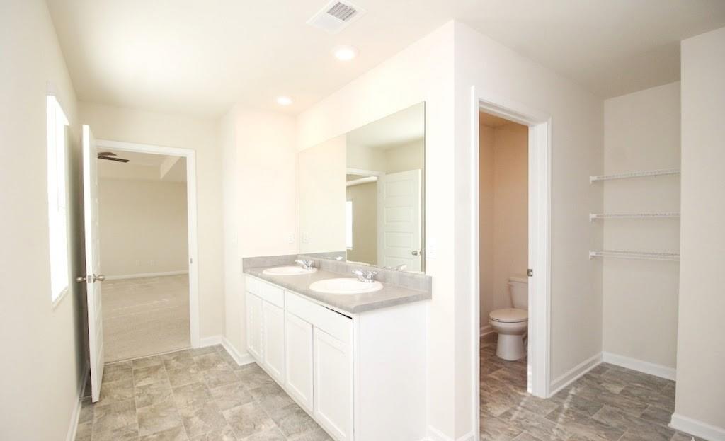 2264 Pelham Pass Dacula, GA 30019 - Photo 32 of 41 a bathroom with a granite countertop sink and shower