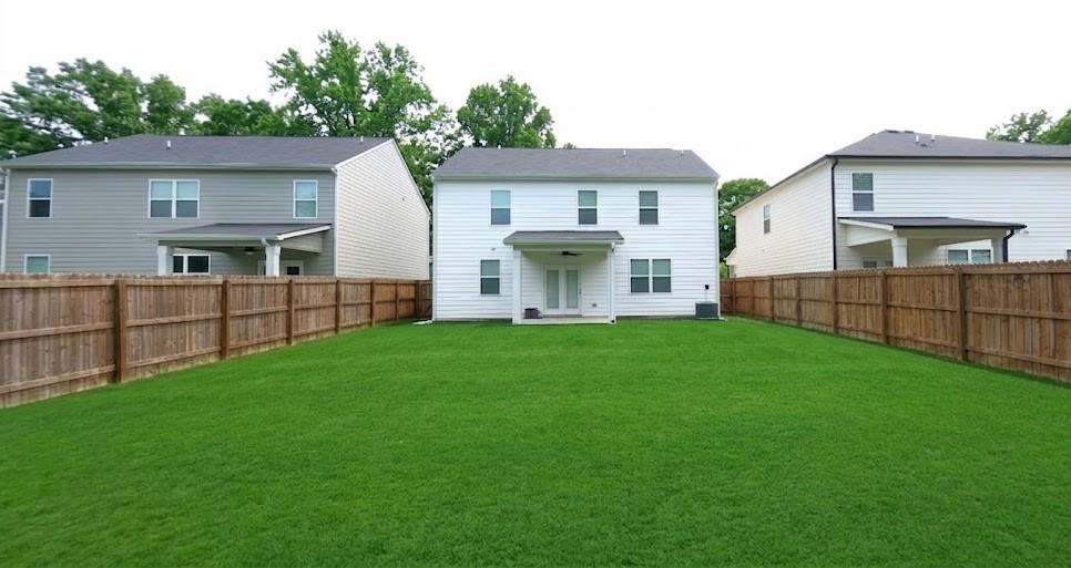2264 Pelham Pass Dacula, GA 30019 - Photo 37 of 41 a view of a house with backyard and a garden