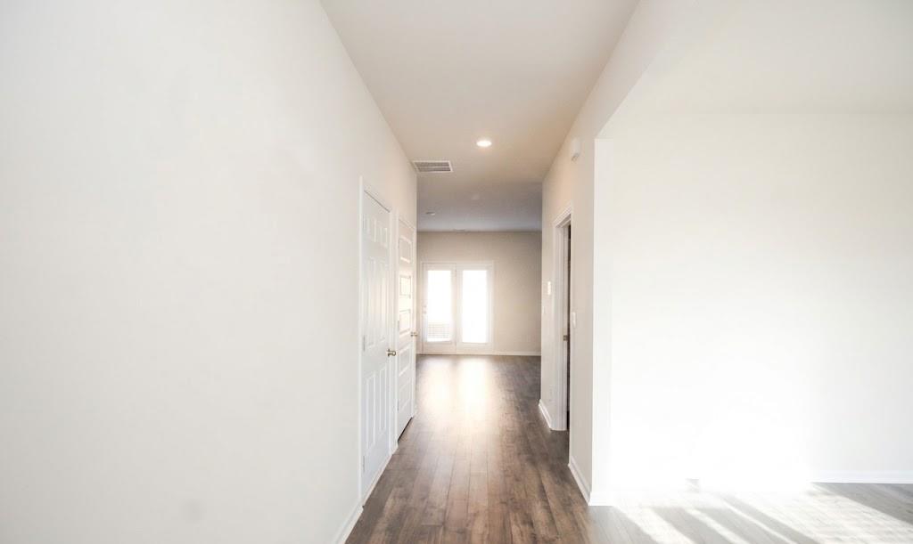 2264 Pelham Pass Dacula, GA 30019 - Photo 7 of 41 a view of a hallway with wooden floor