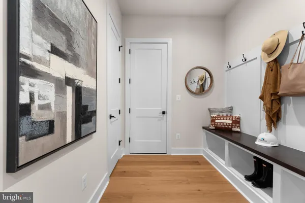 a kitchen with stainless steel appliances a stove a sink and white cabinets