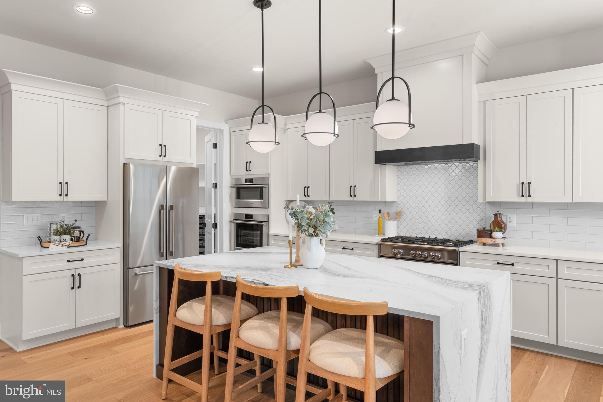 0 Greenwich Road Nokesville, VA 20181 - Photo 29 of 67 a kitchen with stainless steel appliances a stove a sink island and a refrigerator