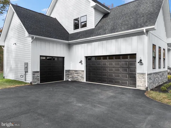 a front view of a house with a garage