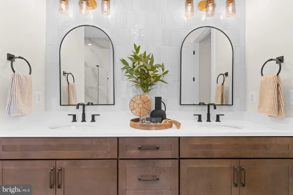 a bathroom with a sink a toilet and bathtub