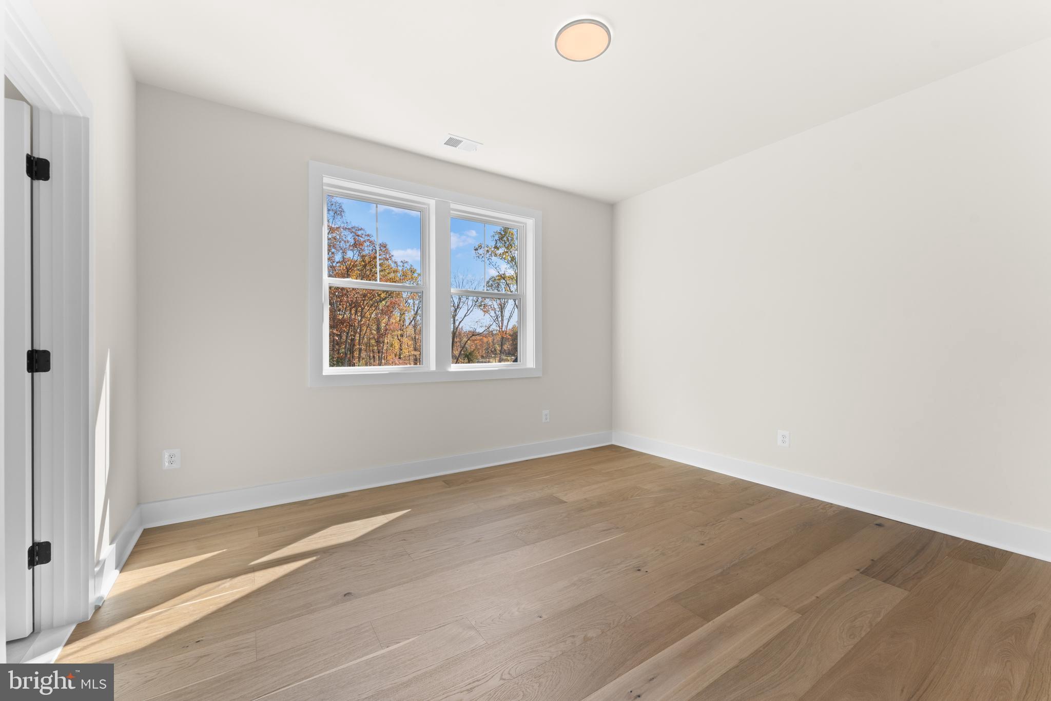 0 Greenwich Road Nokesville, VA 20181 - Photo 46 of 67 an empty room with wooden floor and windows