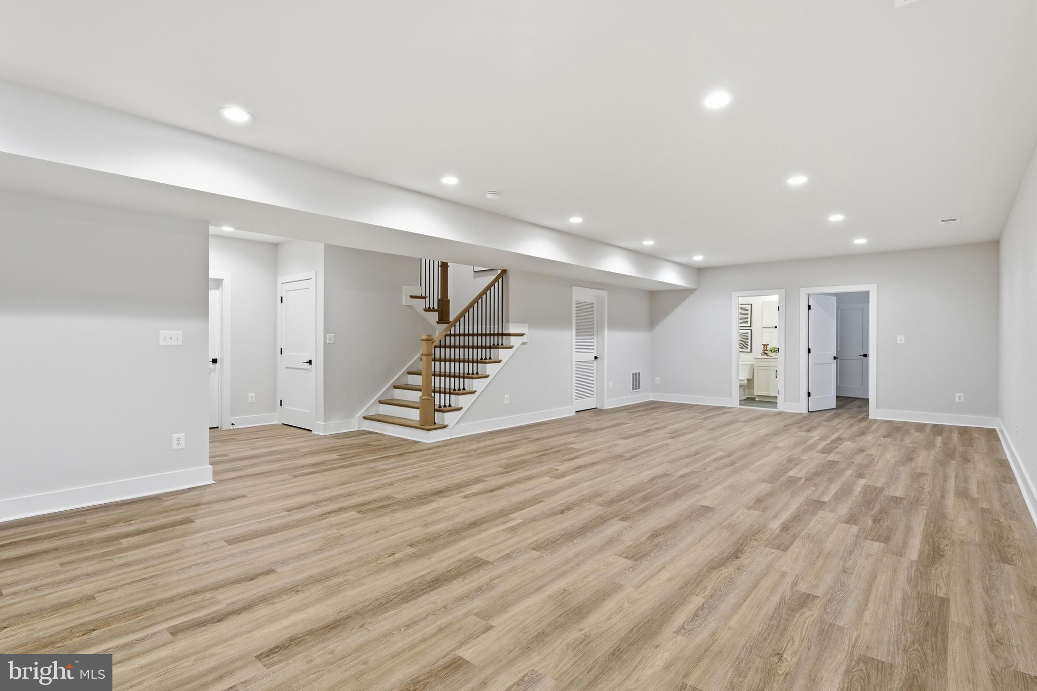 0 Greenwich Road Nokesville, VA 20181 - Photo 59 of 67 a view of an empty room with wooden floor and stairs