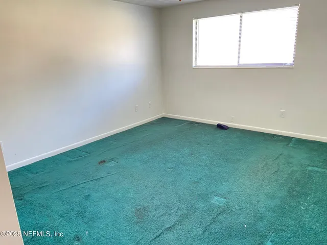 a bathroom with a sink toilet and a mirror