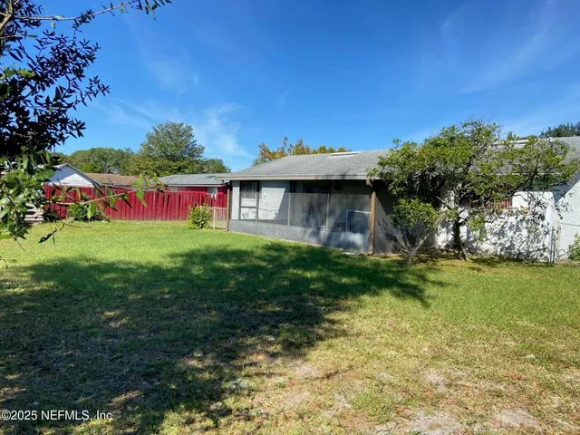 a view of a house with a yard porch and sitting area