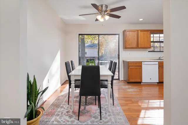 a kitchen with refrigerator and white table