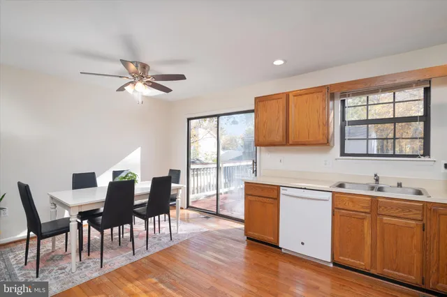 a kitchen with stainless steel appliances granite countertop a refrigerator sink and cabinets