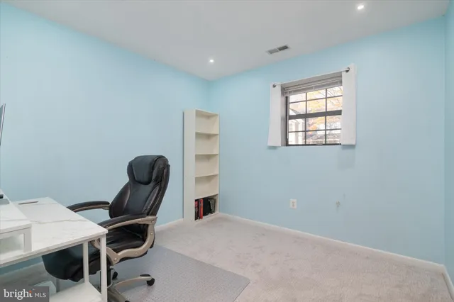 a view of a livingroom with furniture and a flat screen tv