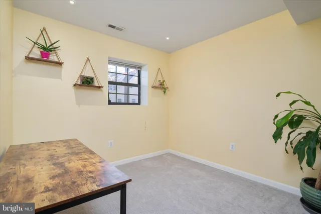 a view of a room with a potted plant