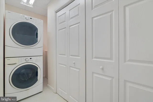 a view of a house with swimming pool and a yard