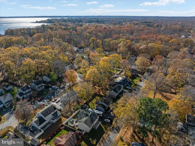 a front view of a house with a yard table and chairs