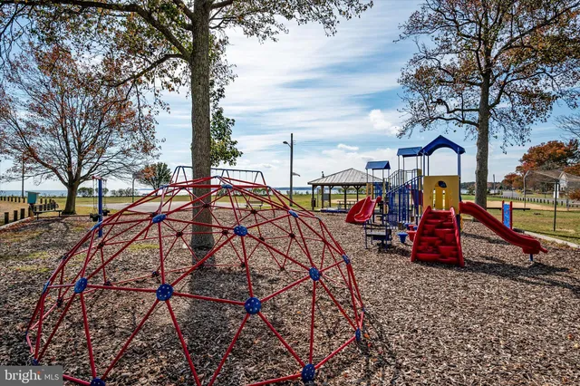 a view of swimming pool with outdoor seating and yard in back