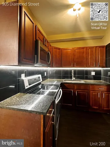 a kitchen that has a sink and a stove