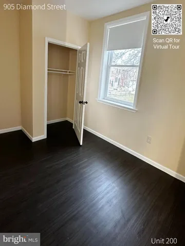 a bathroom with a granite countertop toilet and a sink