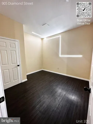 a view of a livingroom with wooden floor