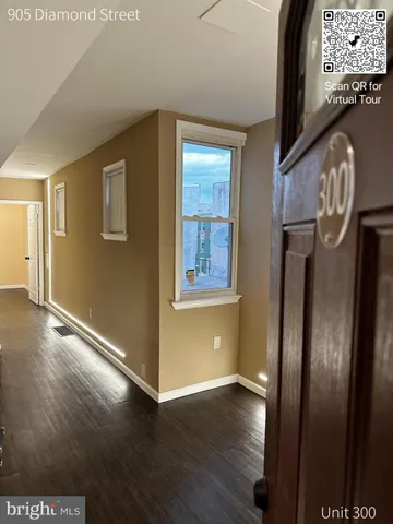 a bathroom with a sink a toilet a mirror and shower