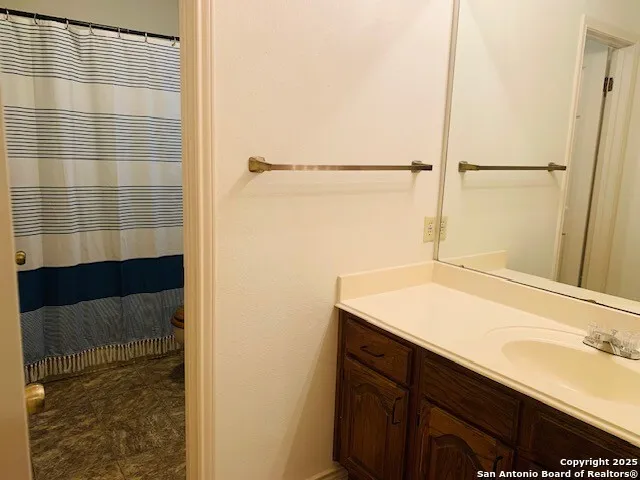 a bathroom with a sink and a shower