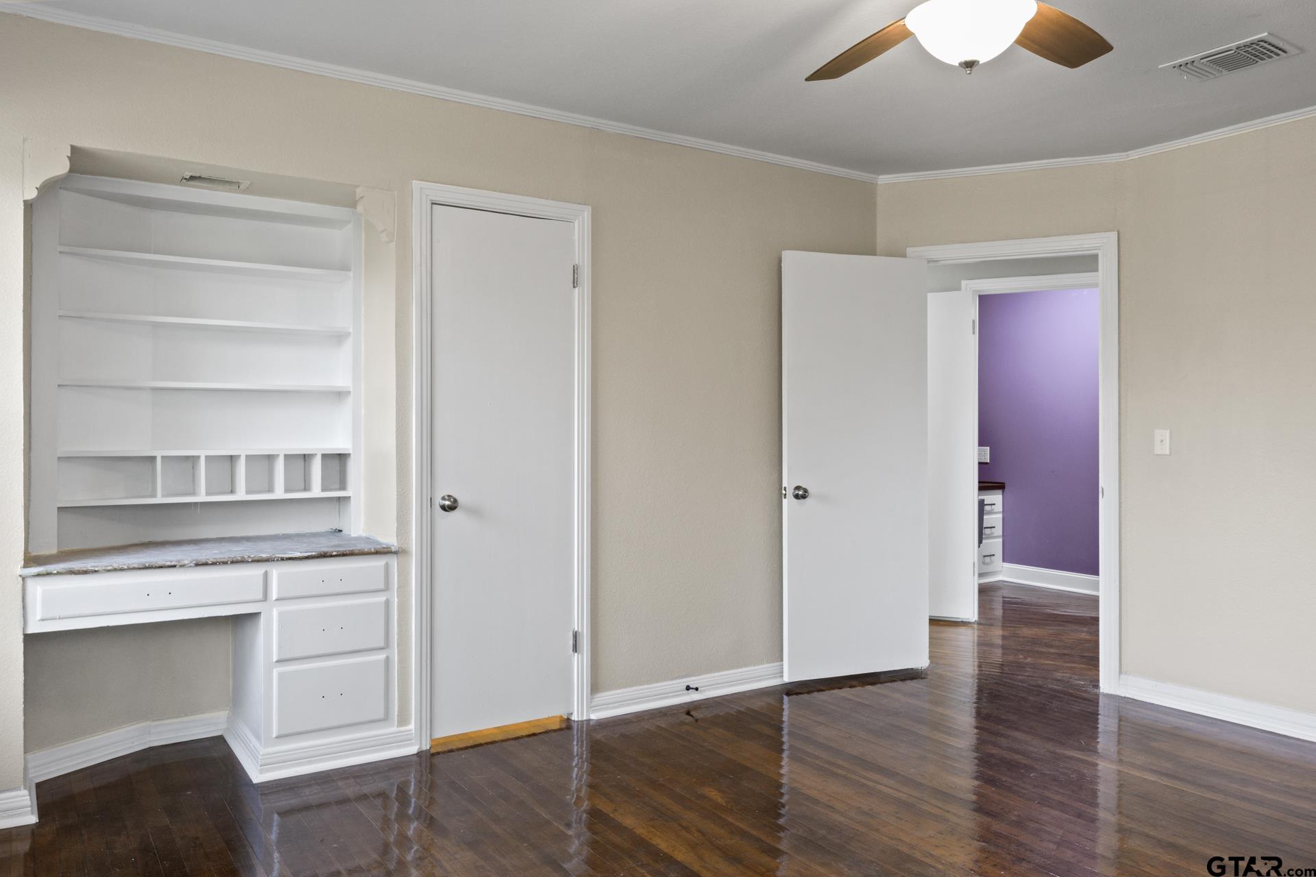 306 Quitman Street Pittsburg, TX 75686 - Photo 13 of 31 a view of cabinets and wooden floor