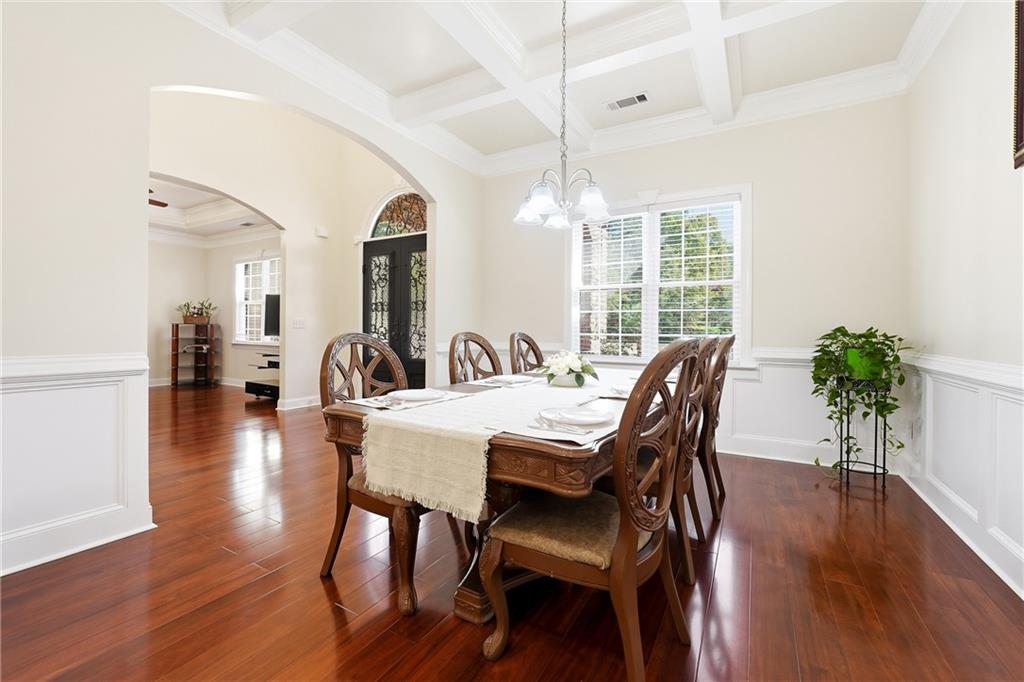 100 Marshas Vineyard Hampton, GA 30228 - Photo 11 of 71 a view of a a dining room with furniture window and wooden floor