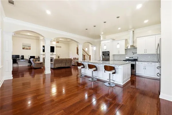 a view of a hallway view with wooden floor and staircase