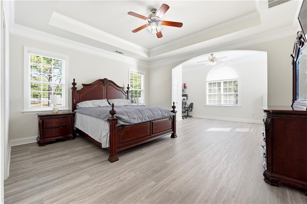 100 Marshas Vineyard Hampton, GA 30228 - Photo 25 of 71 a bedroom with a bed lamp and a window