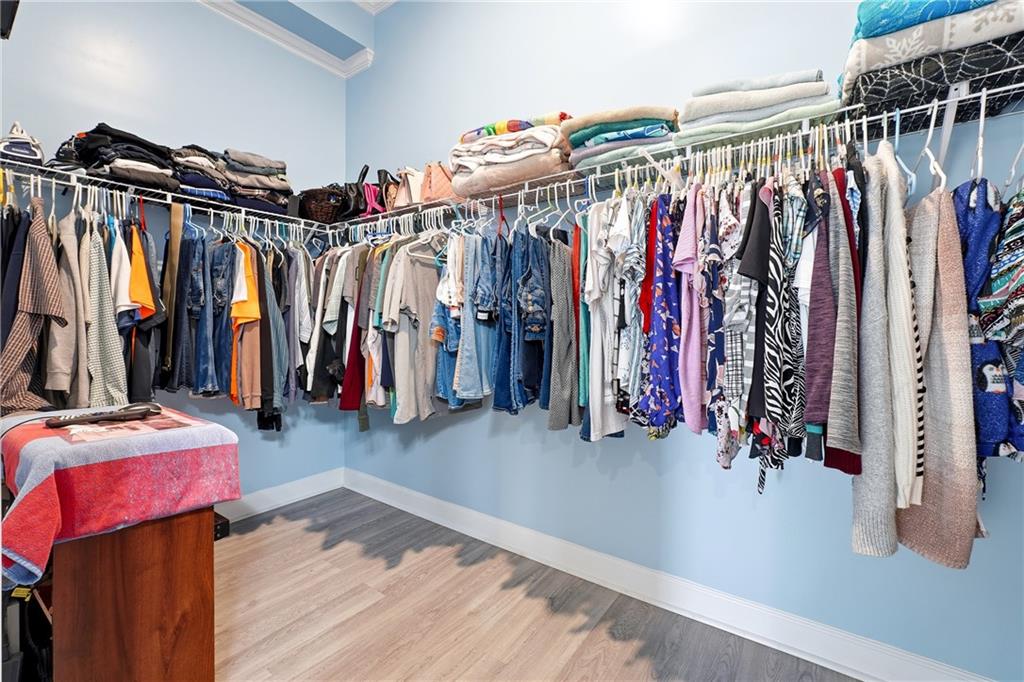 100 Marshas Vineyard Hampton, GA 30228 - Photo 30 of 71 a view of walk in closet with clothes