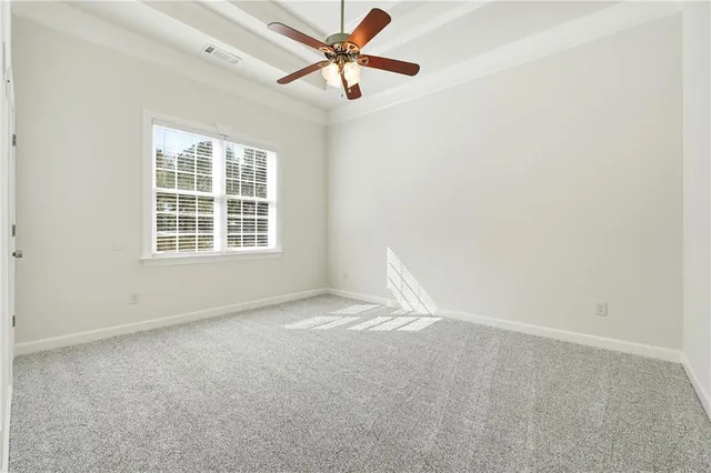 a view of walk in closet with clothes