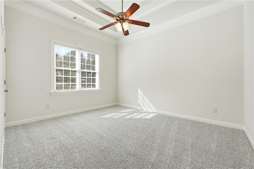 100 Marshas Vineyard Hampton, GA 30228 - Photo 32 of 71 an empty room with a window and a fan