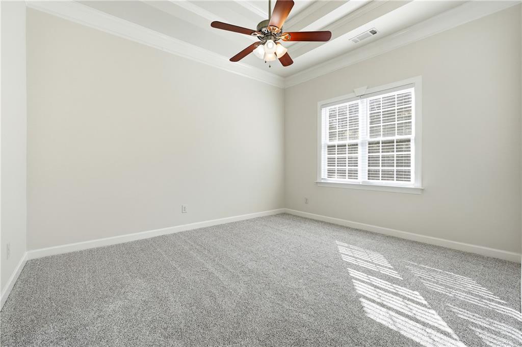 100 Marshas Vineyard Hampton, GA 30228 - Photo 33 of 71 an empty room with windows and fan