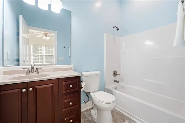 a view of a bathroom from a hallway