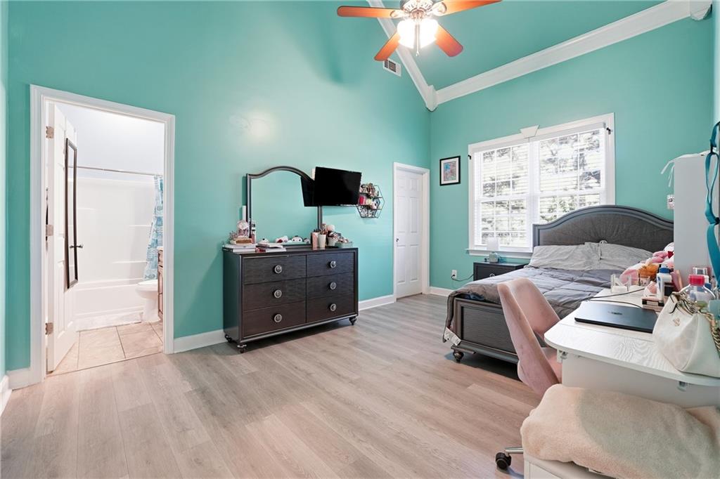 100 Marshas Vineyard Hampton, GA 30228 - Photo 37 of 71 a living room with furniture and a flat screen tv