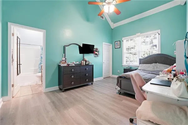 a view of a room with wooden floor