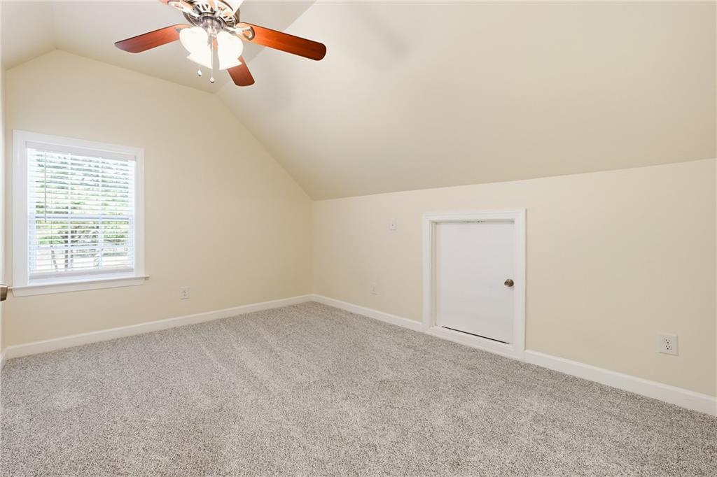 100 Marshas Vineyard Hampton, GA 30228 - Photo 40 of 71 an empty room with a window and a fan