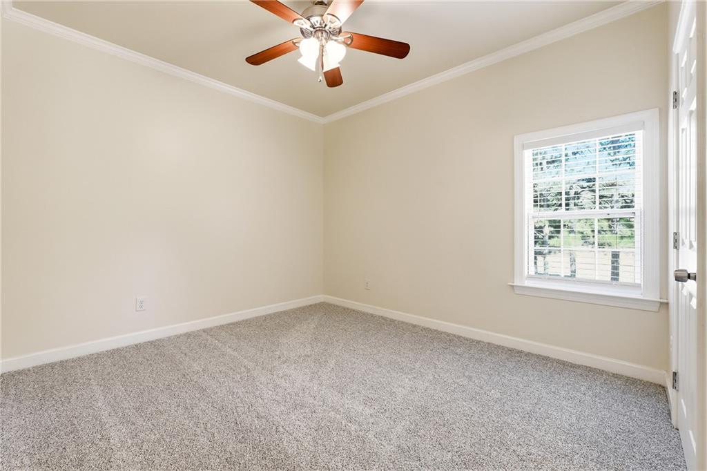 100 Marshas Vineyard Hampton, GA 30228 - Photo 41 of 71 an empty room with a window and a fan